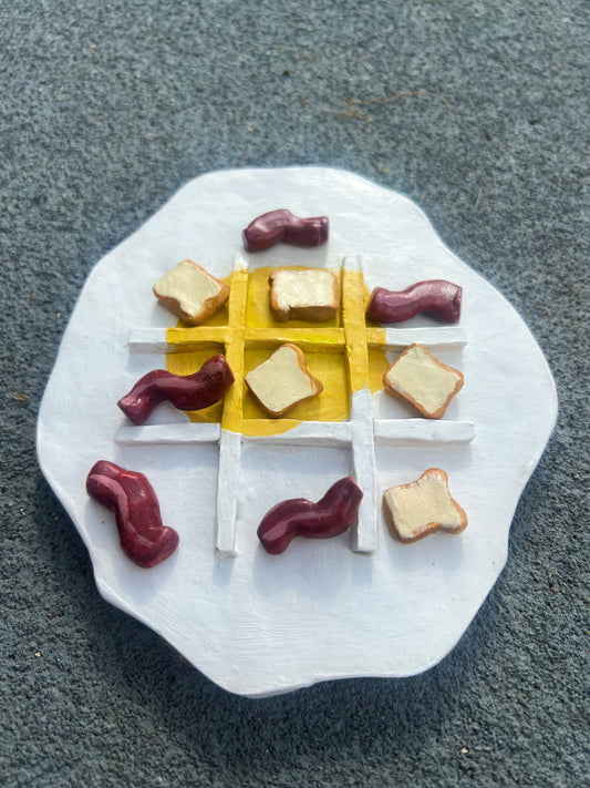 Eggs and bacon waffle tic tac toe board