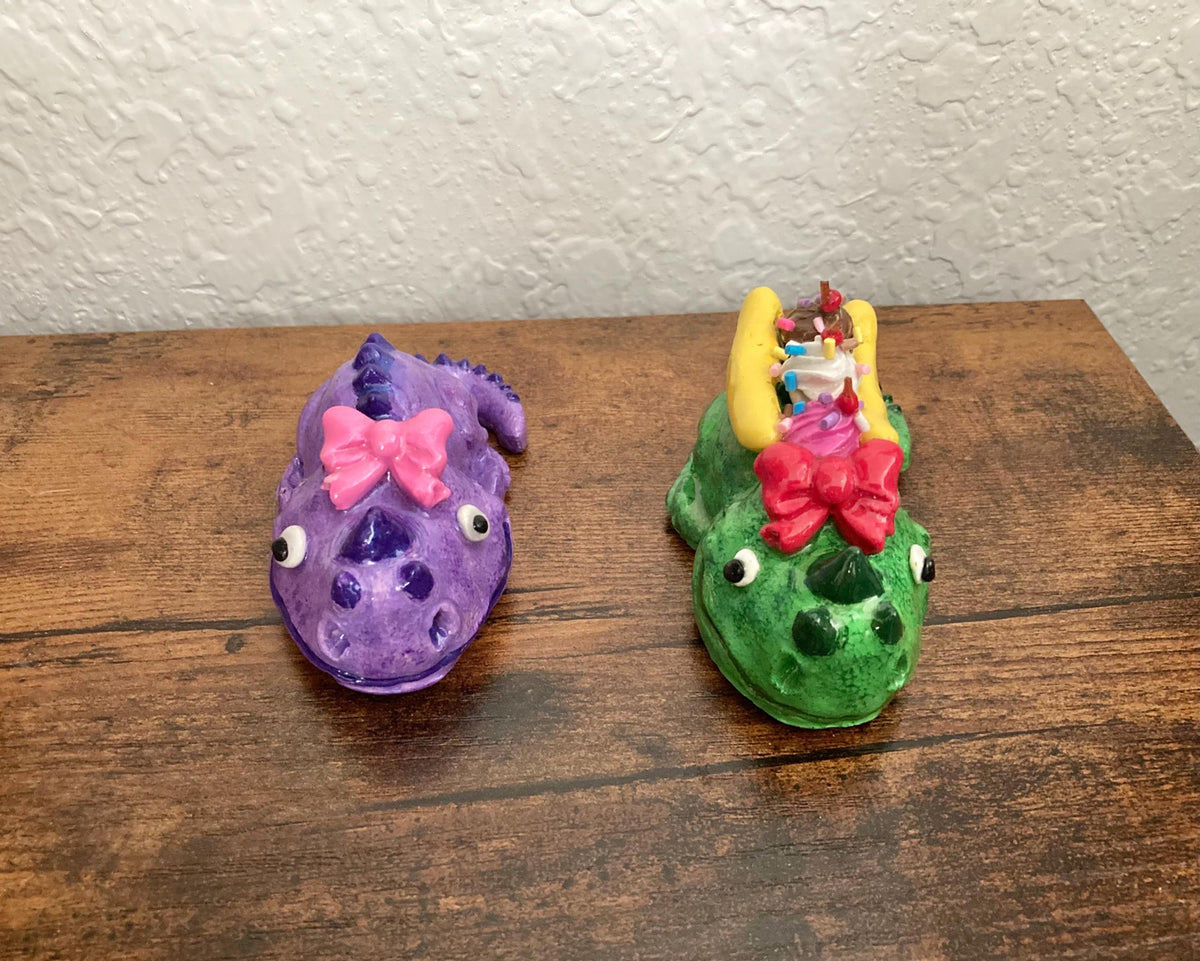 Sculpted lizard creatures