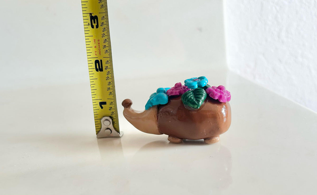 Sculpted hedgehog figurine with flowers