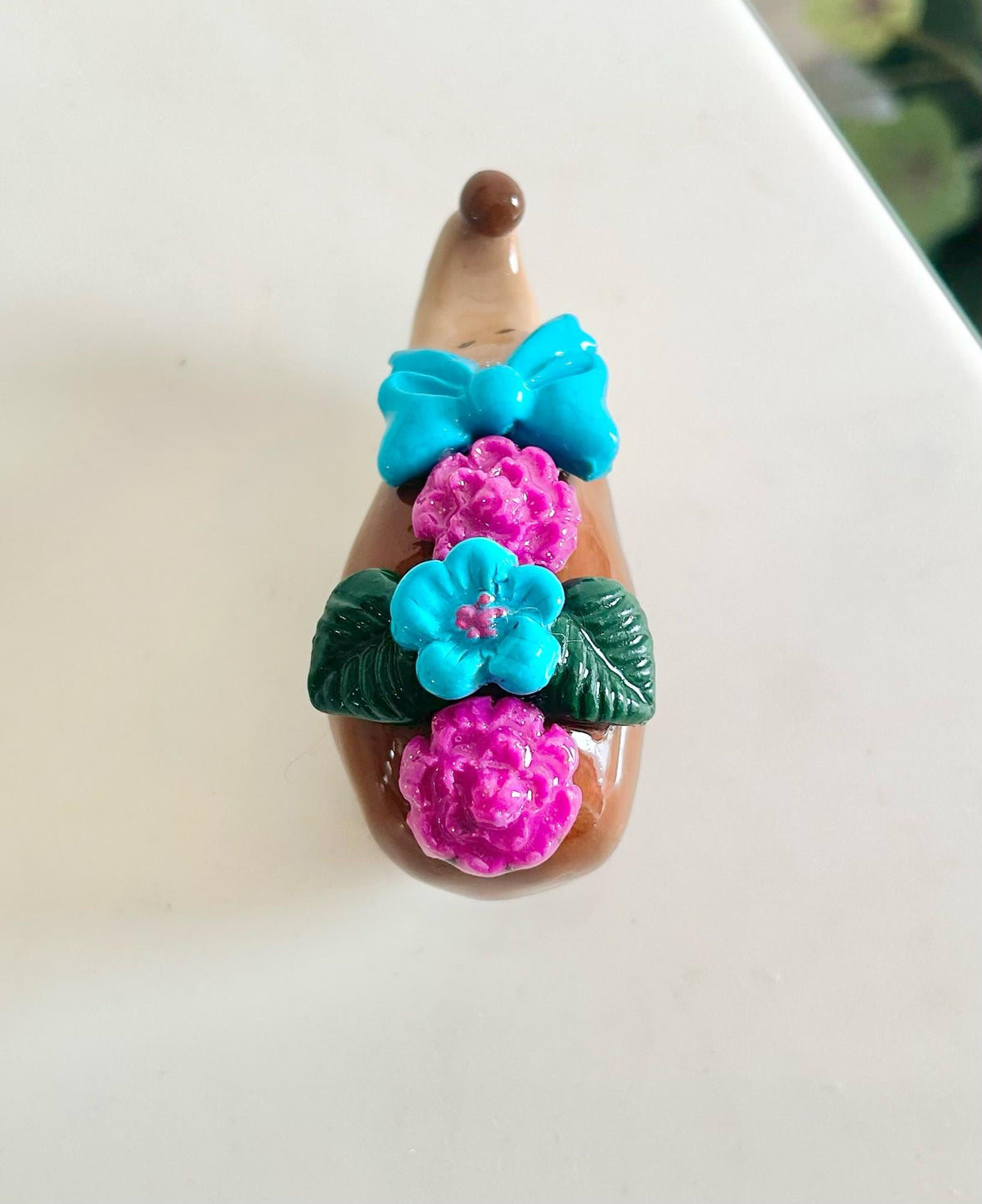 Sculpted hedgehog figurine with flowers