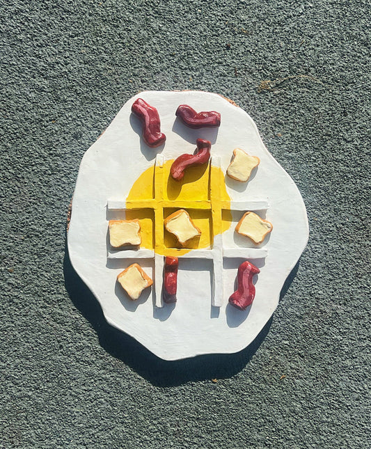 Eggs and bacon waffle tic tac toe board