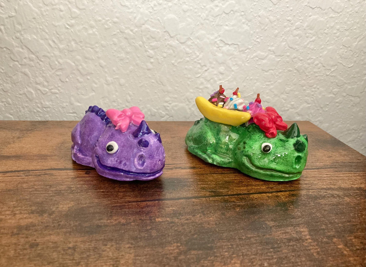 Sculpted lizard creatures