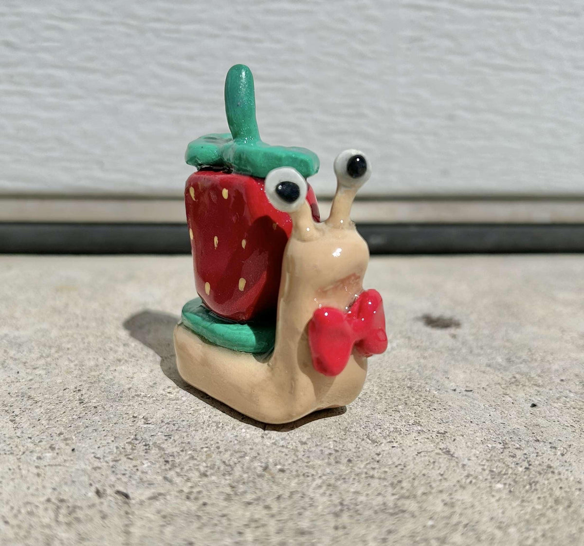 Fruit clay snail figurines