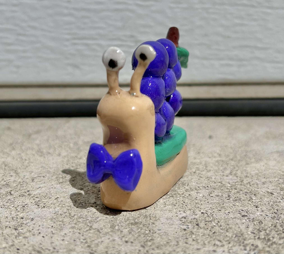 Fruit clay snail figurines