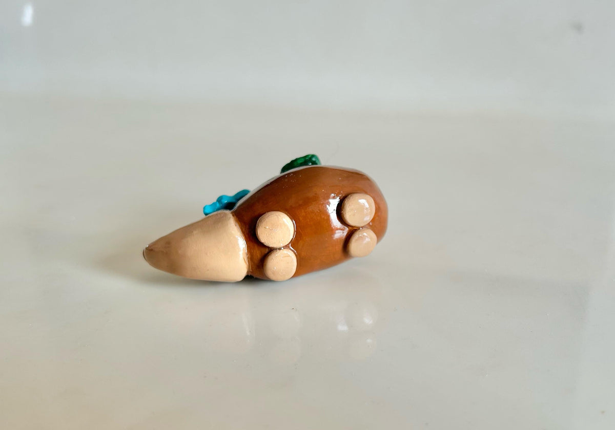 Sculpted hedgehog figurine with flowers