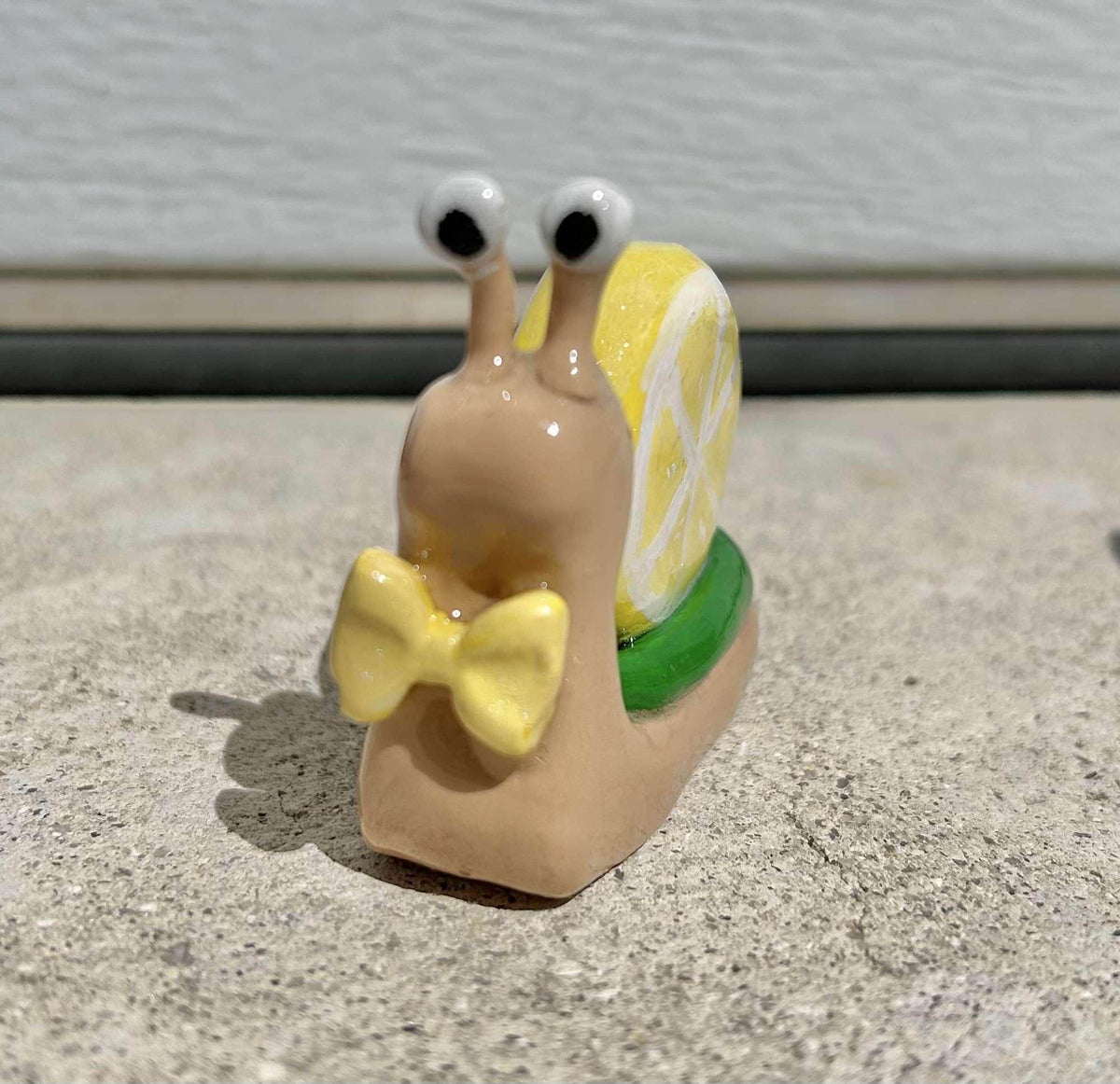 Fruit clay snail figurines